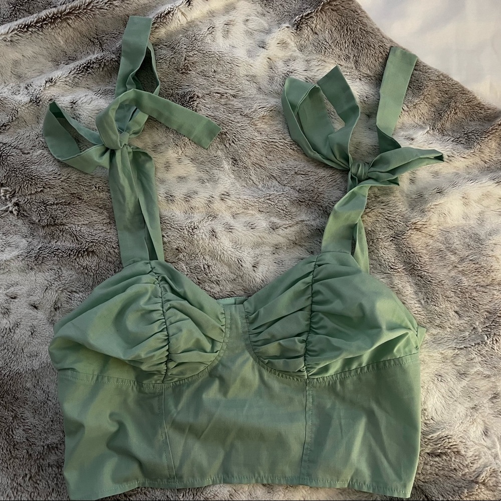 Cropped mint green ASOS corset top.